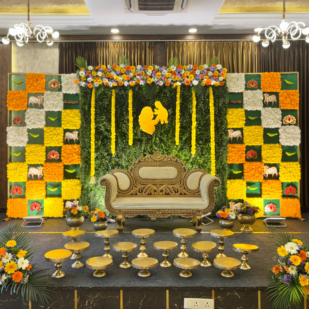 Regal Marigold & Foliage Baby Shower Backdrop in Bangalore